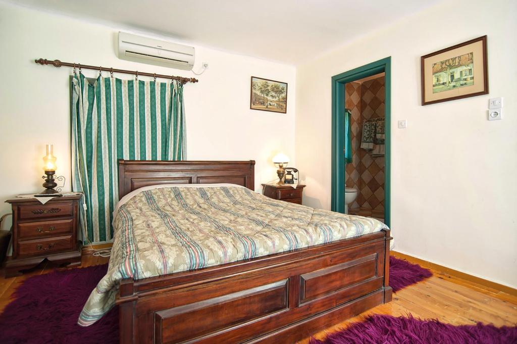 Postel nebo postele na pokoji v ubytování Alexandros Pension
