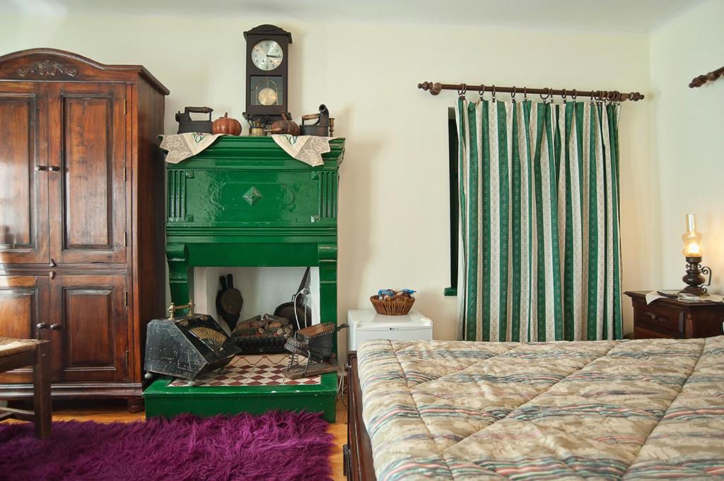 Postel nebo postele na pokoji v ubytování Alexandros Pension