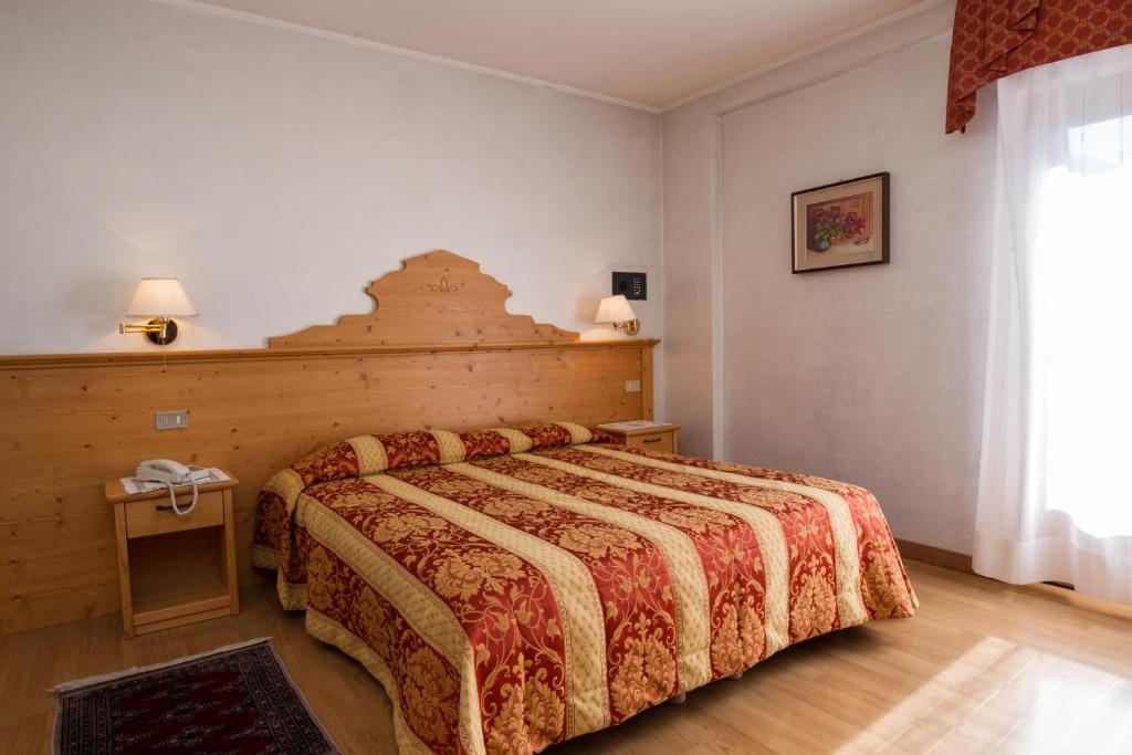 Posteľ alebo postele v izbe v ubytovaní Hotel Al Prato