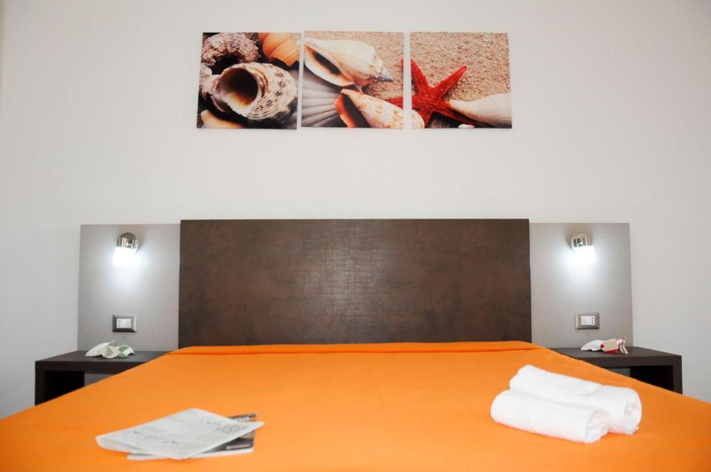 A bed or beds in a room at Torre Lapillo GMA Tourism