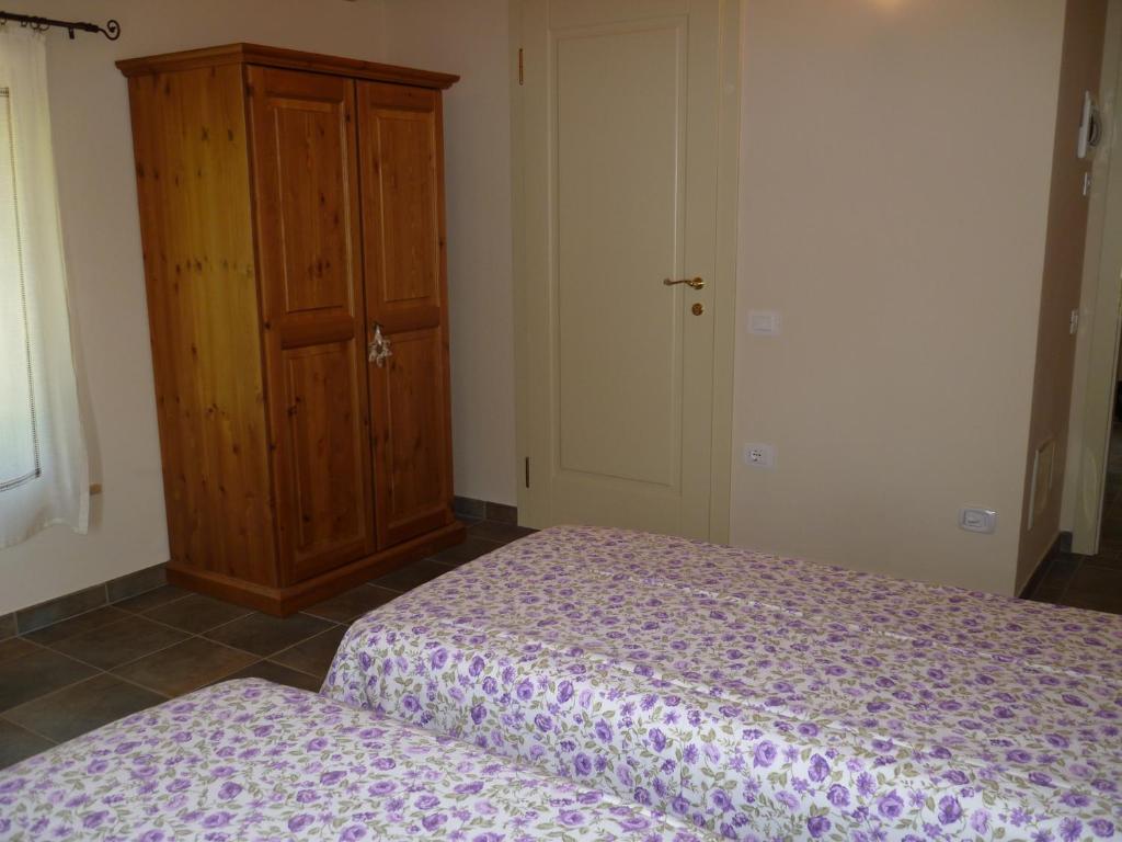 Postel nebo postele na pokoji v ubytování Agriturismo Corte Carolina