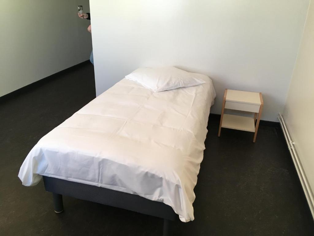 Postel nebo postele na pokoji v ubytování L'Escale