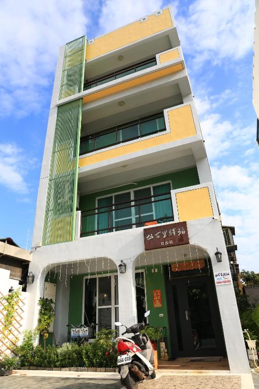 a motorcycle parked in front of a building at 500Km Home in Hualien City