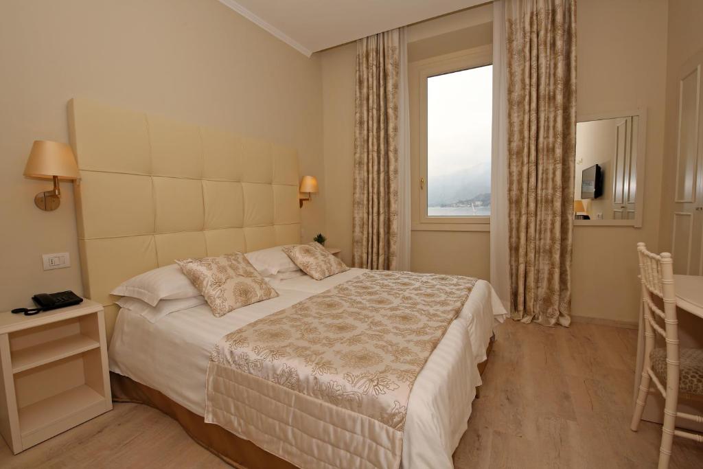 Postel nebo postele na pokoji v ubytování Hotel Du Lac & SPA