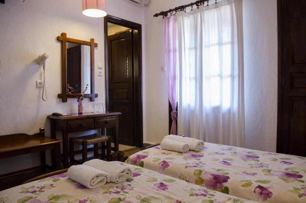 Postel nebo postele na pokoji v ubytování Elli Hotel