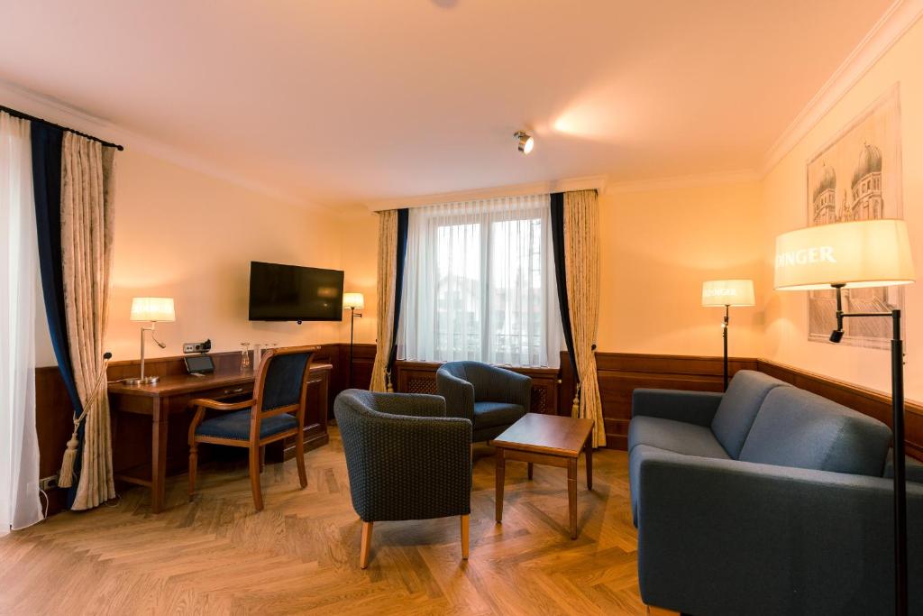 TV a/nebo společenská místnost v ubytování Hotel & Gaststätte zum Erdinger Weißbräu