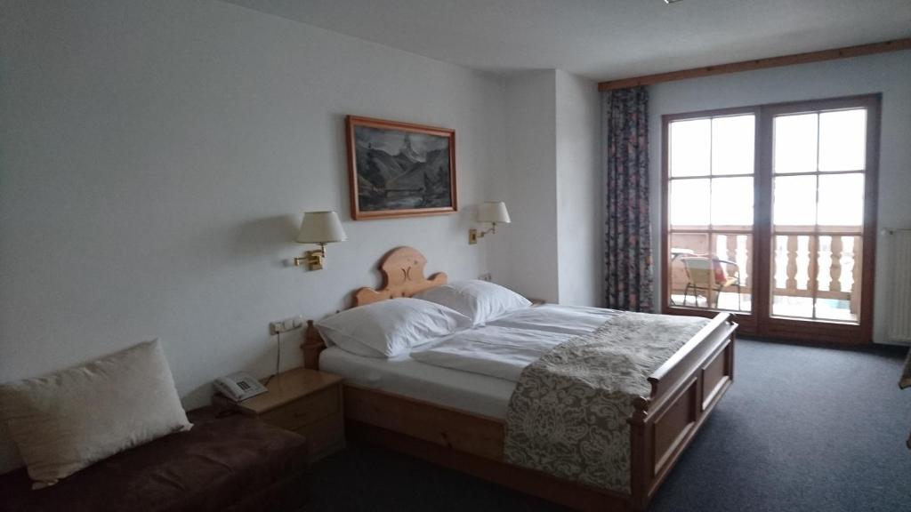 Postel nebo postele na pokoji v ubytování Hotel Wiesenegg
