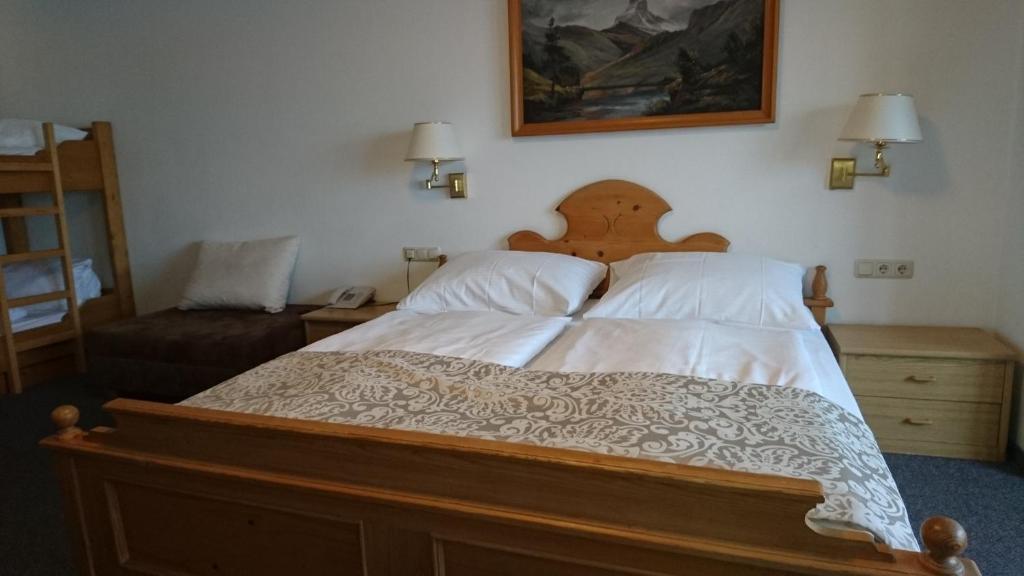 Postel nebo postele na pokoji v ubytování Hotel Wiesenegg