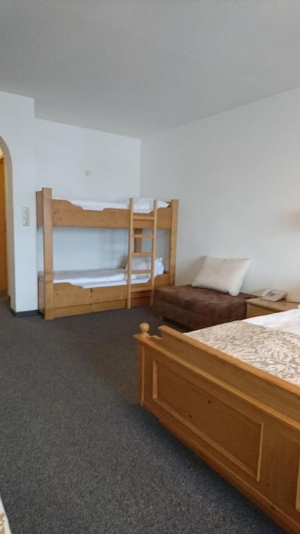 Postel nebo postele na pokoji v ubytování Hotel Wiesenegg