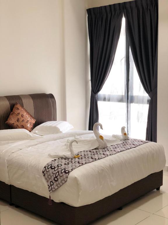 Postel nebo postele na pokoji v ubytování ATS Cameron Hotel & Apartments