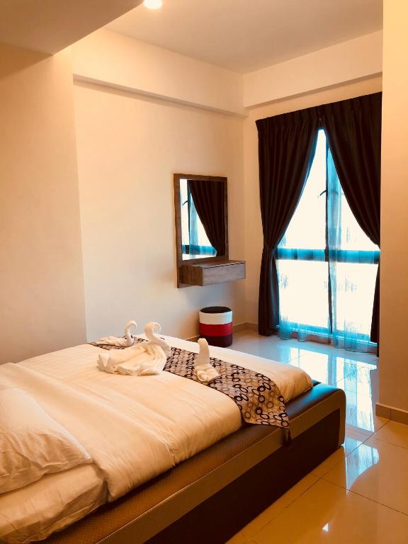 Postel nebo postele na pokoji v ubytování ATS Cameron Hotel & Apartments