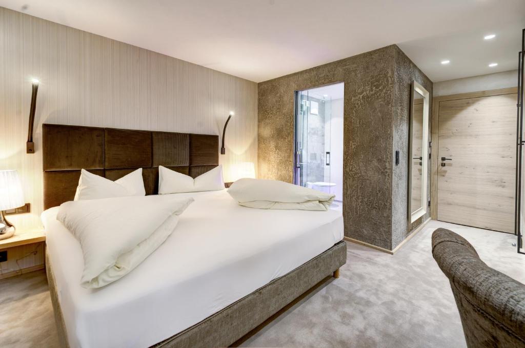 Postel nebo postele na pokoji v ubytování Hotel Rose