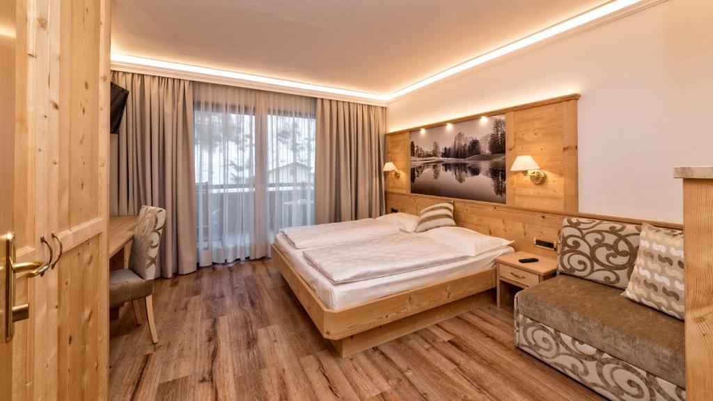 Postel nebo postele na pokoji v ubytování Hotel Armin