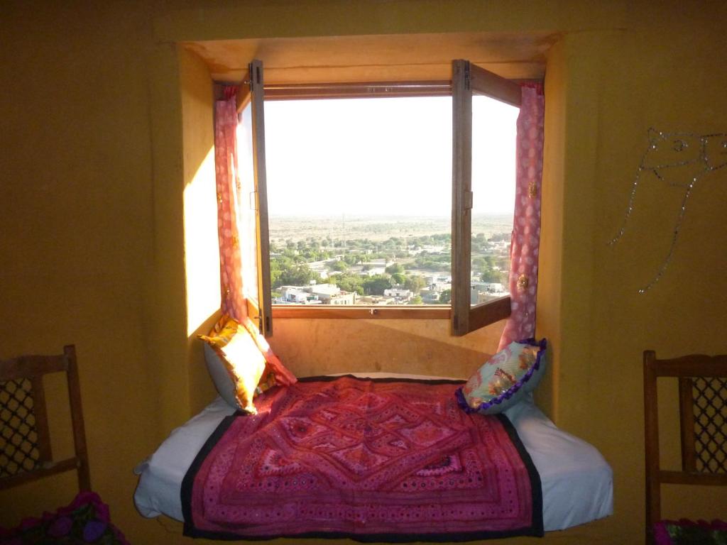 Postel nebo postele na pokoji v ubytování Mud Mirror Guesthouse