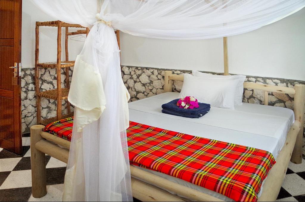 Llit o llits en una habitació de Kimte Beach Lodge