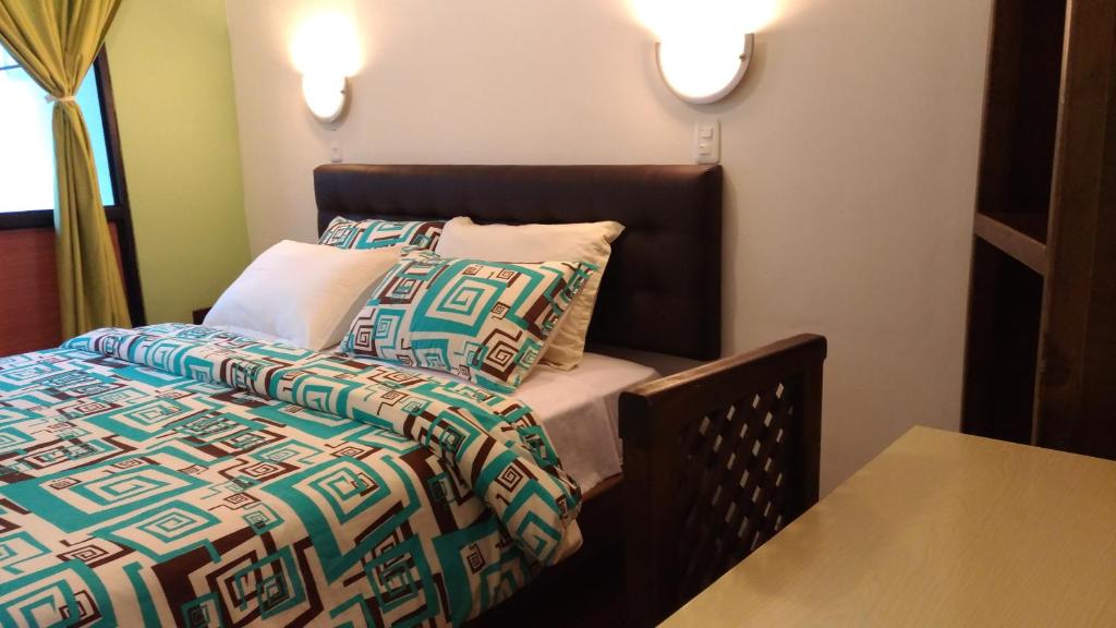 Postel nebo postele na pokoji v ubytování Hostal & Spa Casa Real