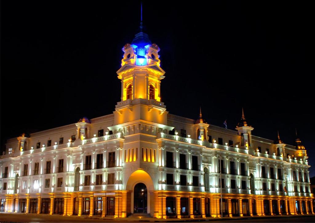a large building with a clock on the front of it at Boutique Hotel 32 in Batumi