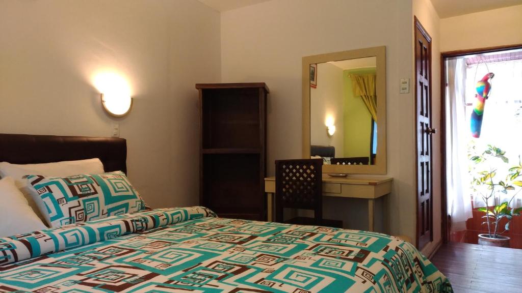 Postel nebo postele na pokoji v ubytování Hostal & Spa Casa Real