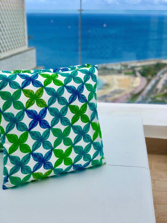 a pillow sitting on a table next to a window at Holiday Club Jardin Amadores in Amadores