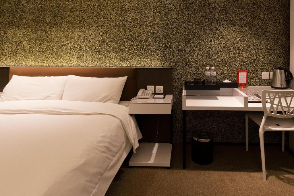 Ένα ή περισσότερα κρεβάτια σε δωμάτιο στο Hotel Puri Taipei Station Branch