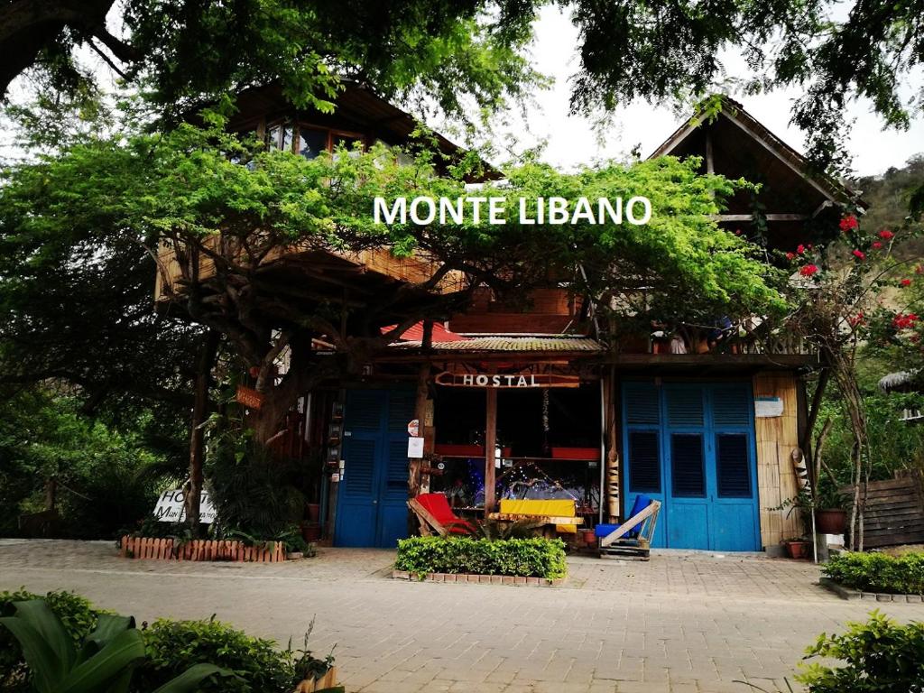 Ein Laden mit einem Schild, das Motte-lophone liest. in der Unterkunft hostal Monte Libano in Puerto López