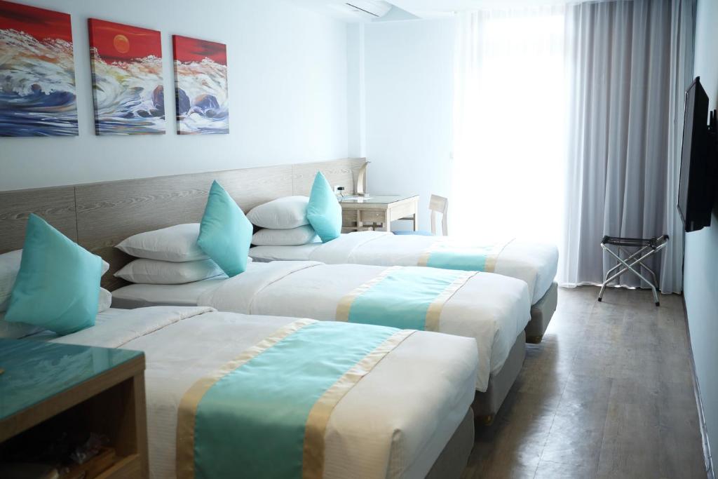 Postel nebo postele na pokoji v ubytování Palau Hotel