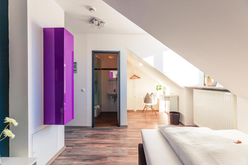 Postel nebo postele na pokoji v ubytování Hotel Arooma