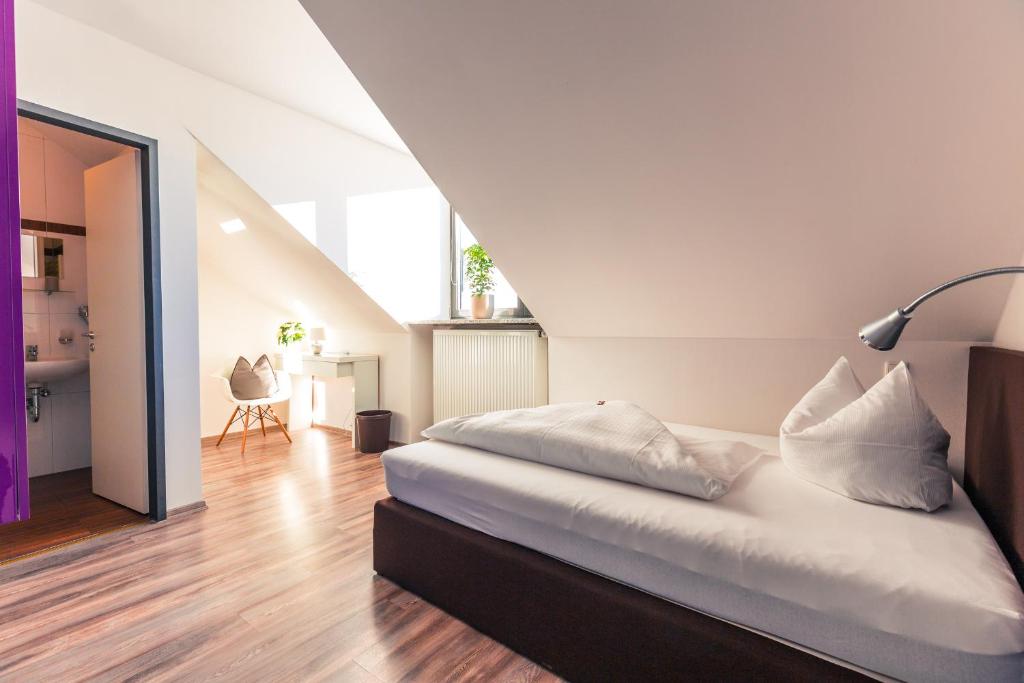 Postel nebo postele na pokoji v ubytování Hotel Arooma