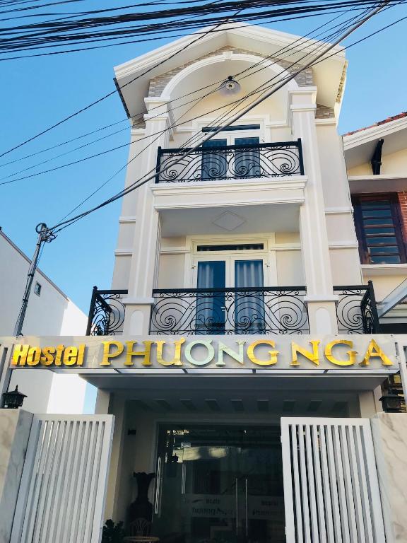 a building with a sign in front of it at Hostel Phuong Nga in Da Lat