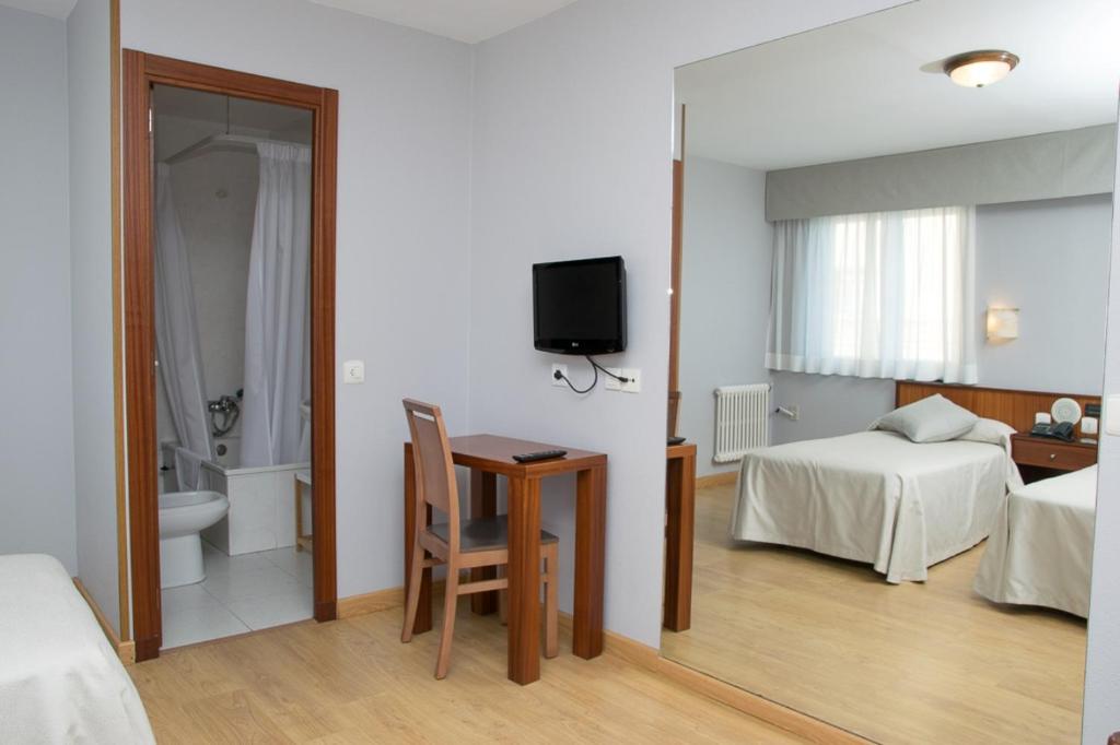 Cama o camas de una habitación en Hotel Brisa