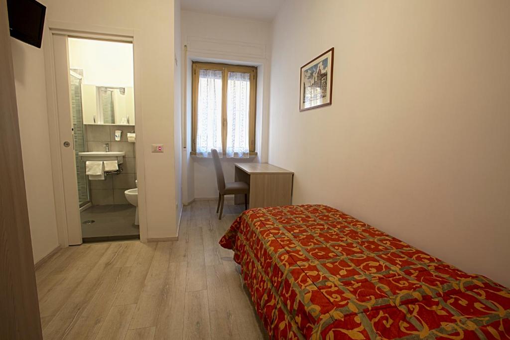 Postel nebo postele na pokoji v ubytování Hotel Adriatic