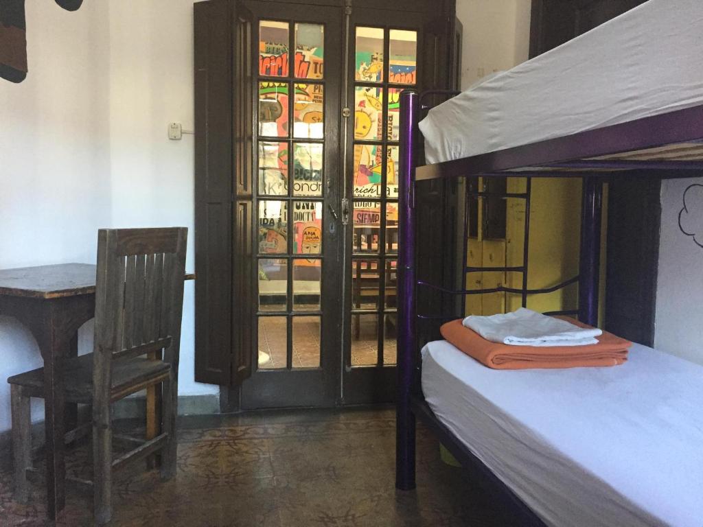 Postel nebo postele na pokoji v ubytování Rivera Hostel Córdoba