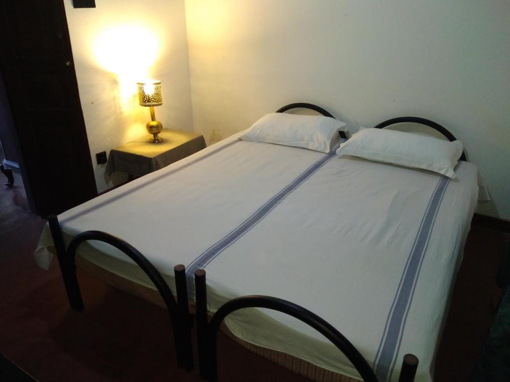 Postel nebo postele na pokoji v ubytování Hotel La Felicita