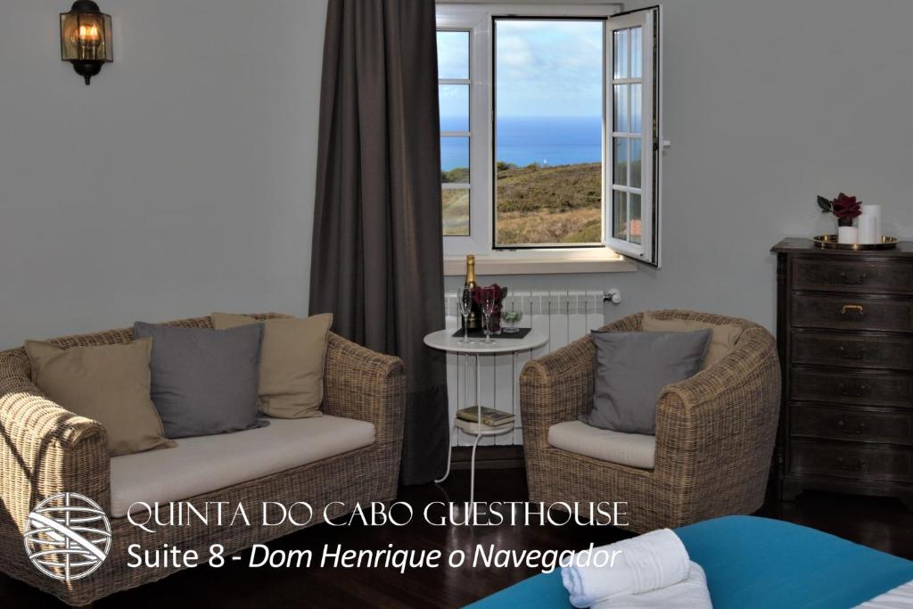 a living room with a couch and two chairs and a window at Quinta do Cabo Guesthouse in Sintra