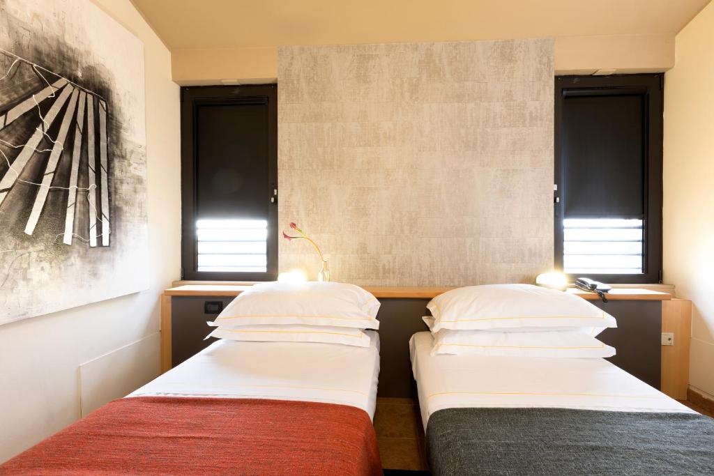 Postel nebo postele na pokoji v ubytování Albavilla Hotel & Co