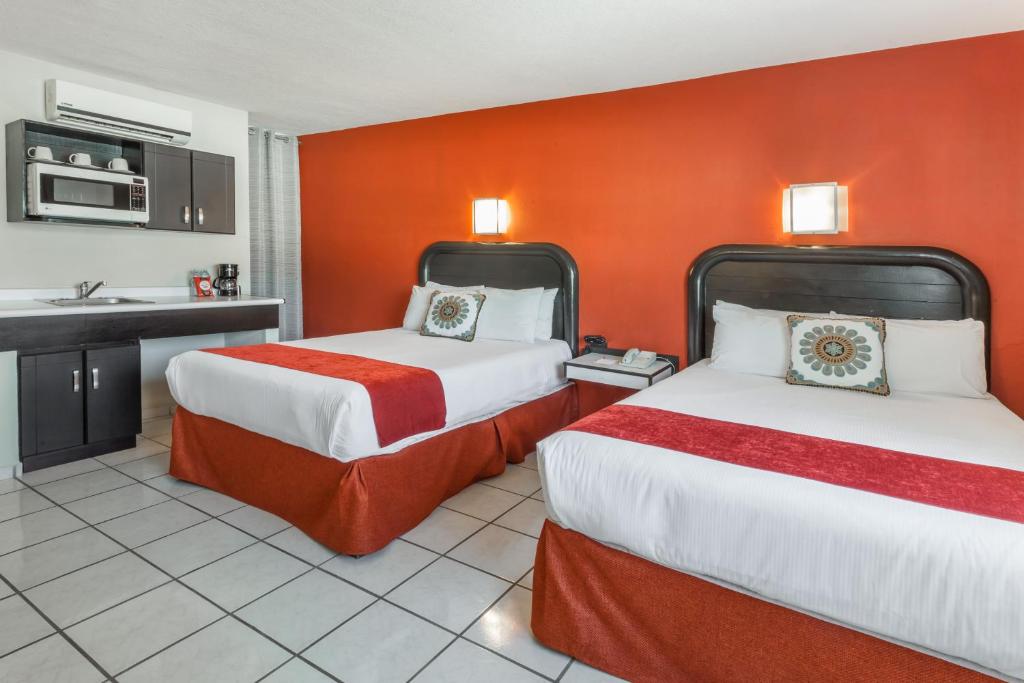 Uma cama ou camas num quarto em Howard Johnson by Wyndham Guanajuato Leon Avenida