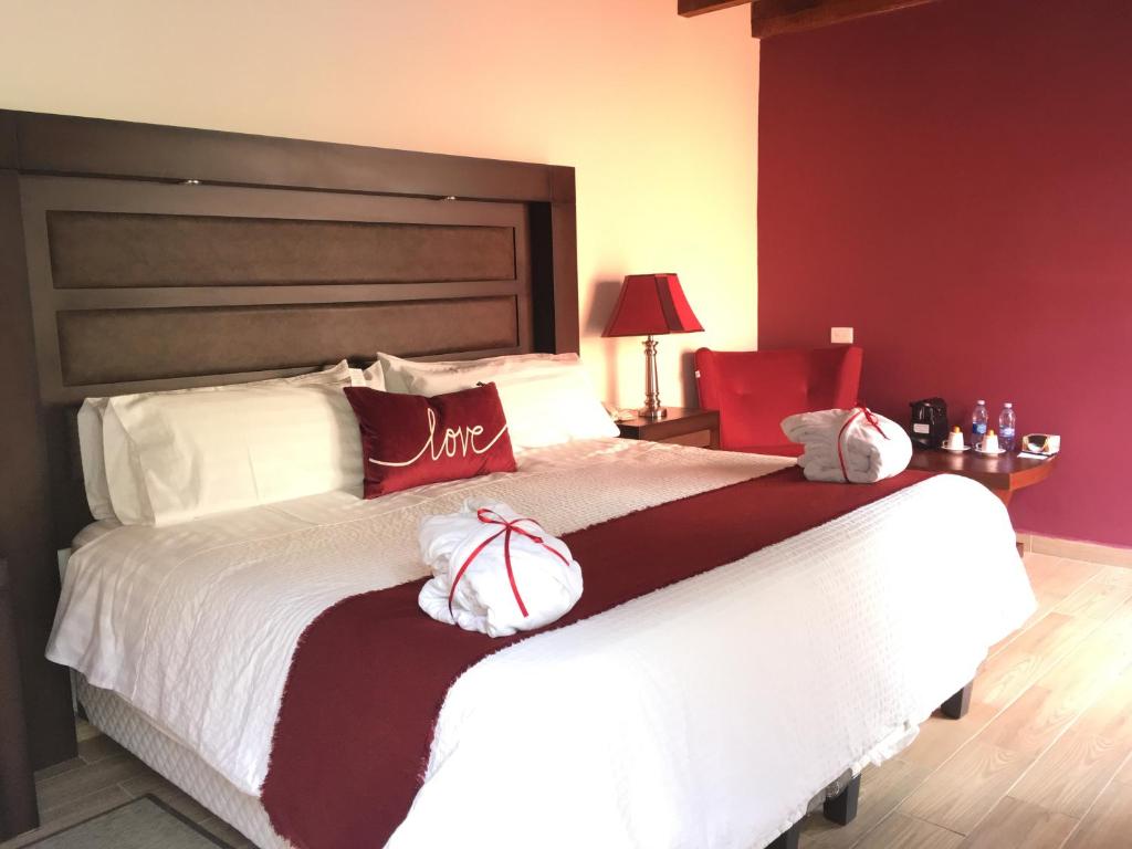 Postel nebo postele na pokoji v ubytování Hotel Casa Don Quijote
