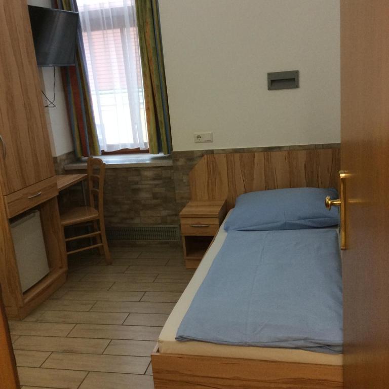 Postel nebo postele na pokoji v ubytování Hotel Pribitzer