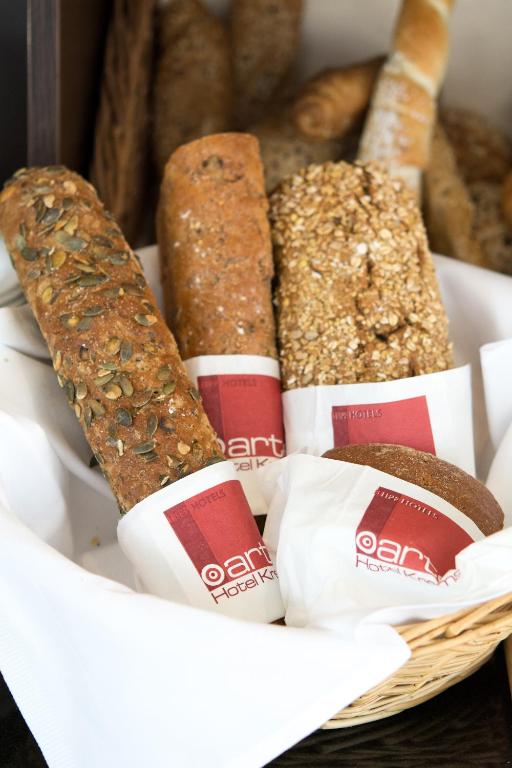 a basket of different types of bread at arte Hotel Krems in Krems an der Donau
