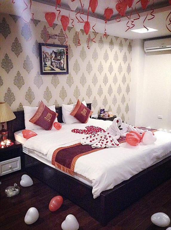 Postel nebo postele na pokoji v ubytování Mely Hotel Hà Nội