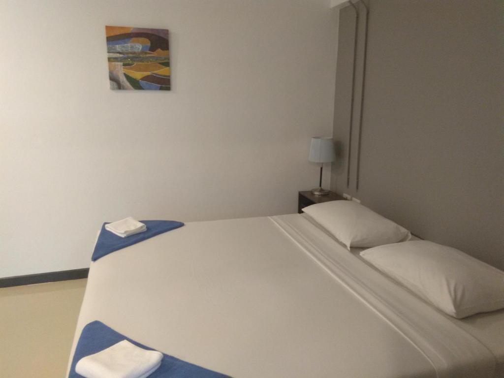 Postel nebo postele na pokoji v ubytování Phi Phi Inn