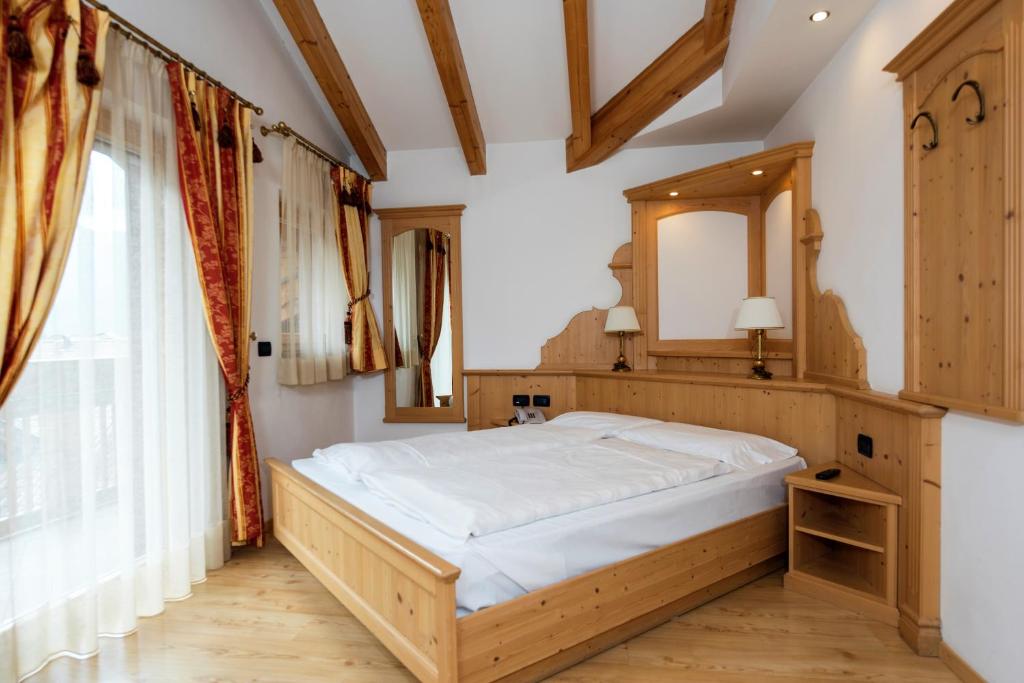 Postel nebo postele na pokoji v ubytování Hotel B&B Andreas