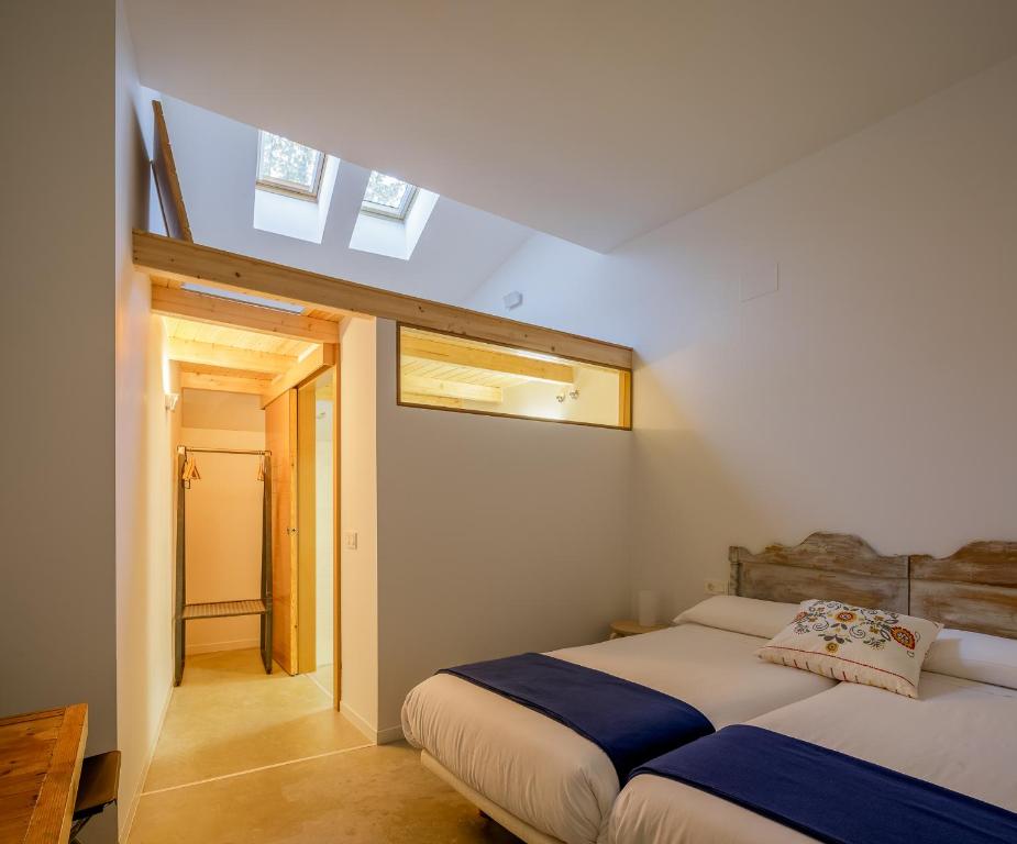 Postel nebo postele na pokoji v ubytování Casa la Devesa de Sanabria