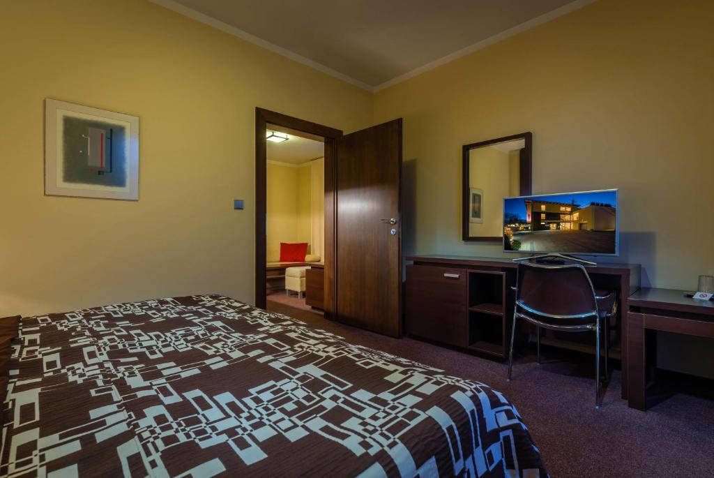 Postel nebo postele na pokoji v ubytování Hotel Villa Bianca