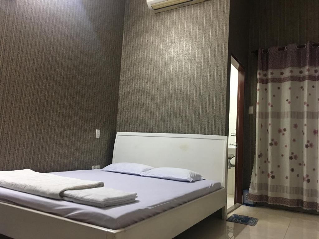 Postel nebo postele na pokoji v ubytování Thu Đô Motel