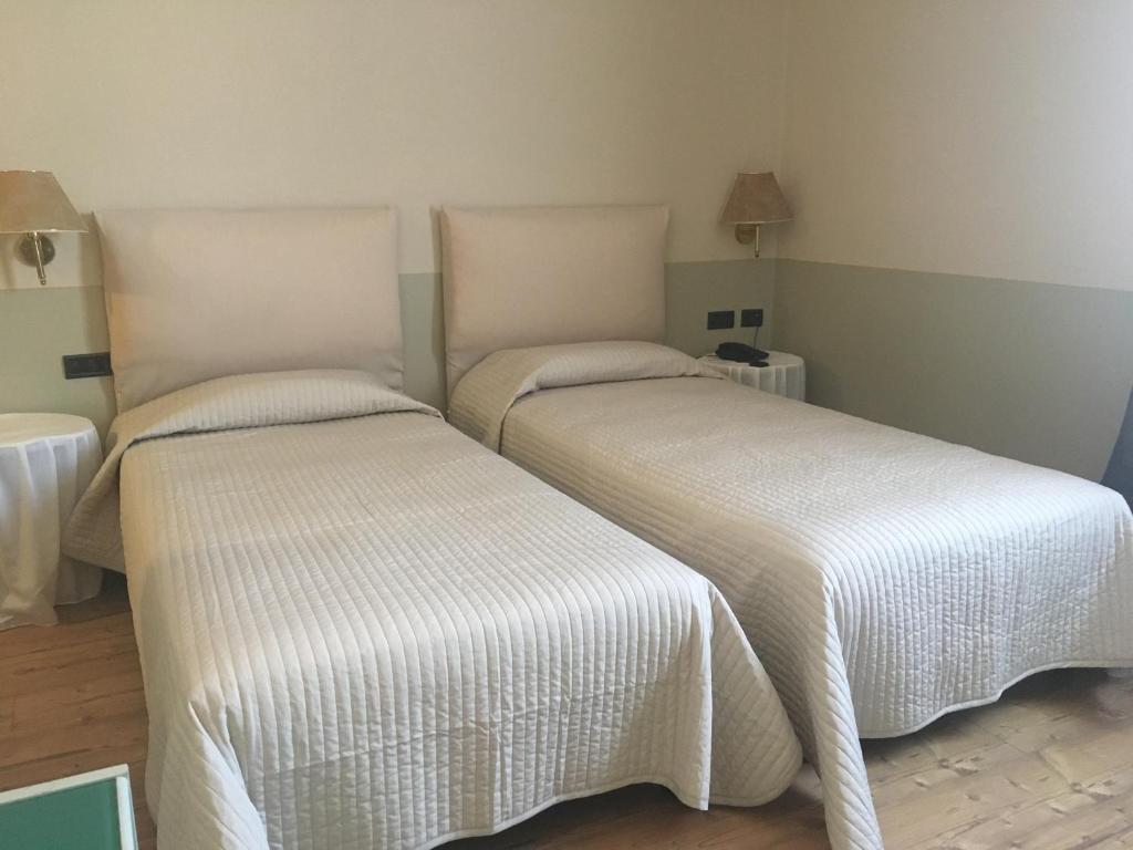 Postel nebo postele na pokoji v ubytování Green Hotel