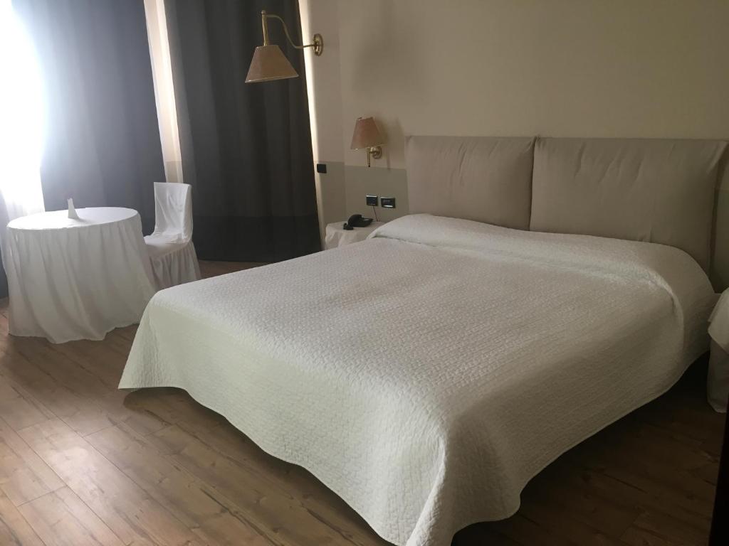 Postel nebo postele na pokoji v ubytování Green Hotel