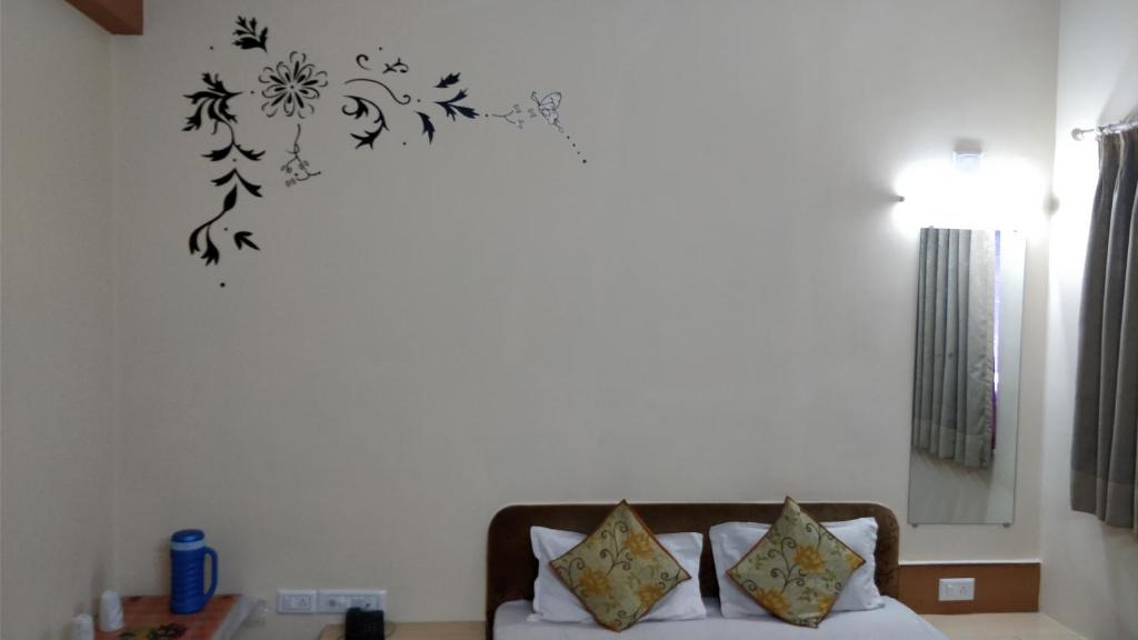 Postel nebo postele na pokoji v ubytování Hotel Damjis