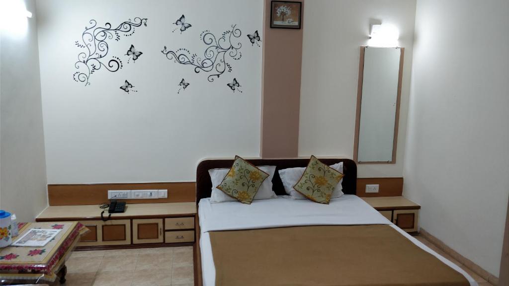 Postel nebo postele na pokoji v ubytování Hotel Damjis