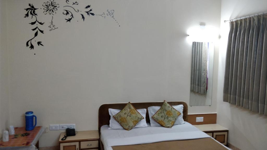 Postel nebo postele na pokoji v ubytování Hotel Damjis